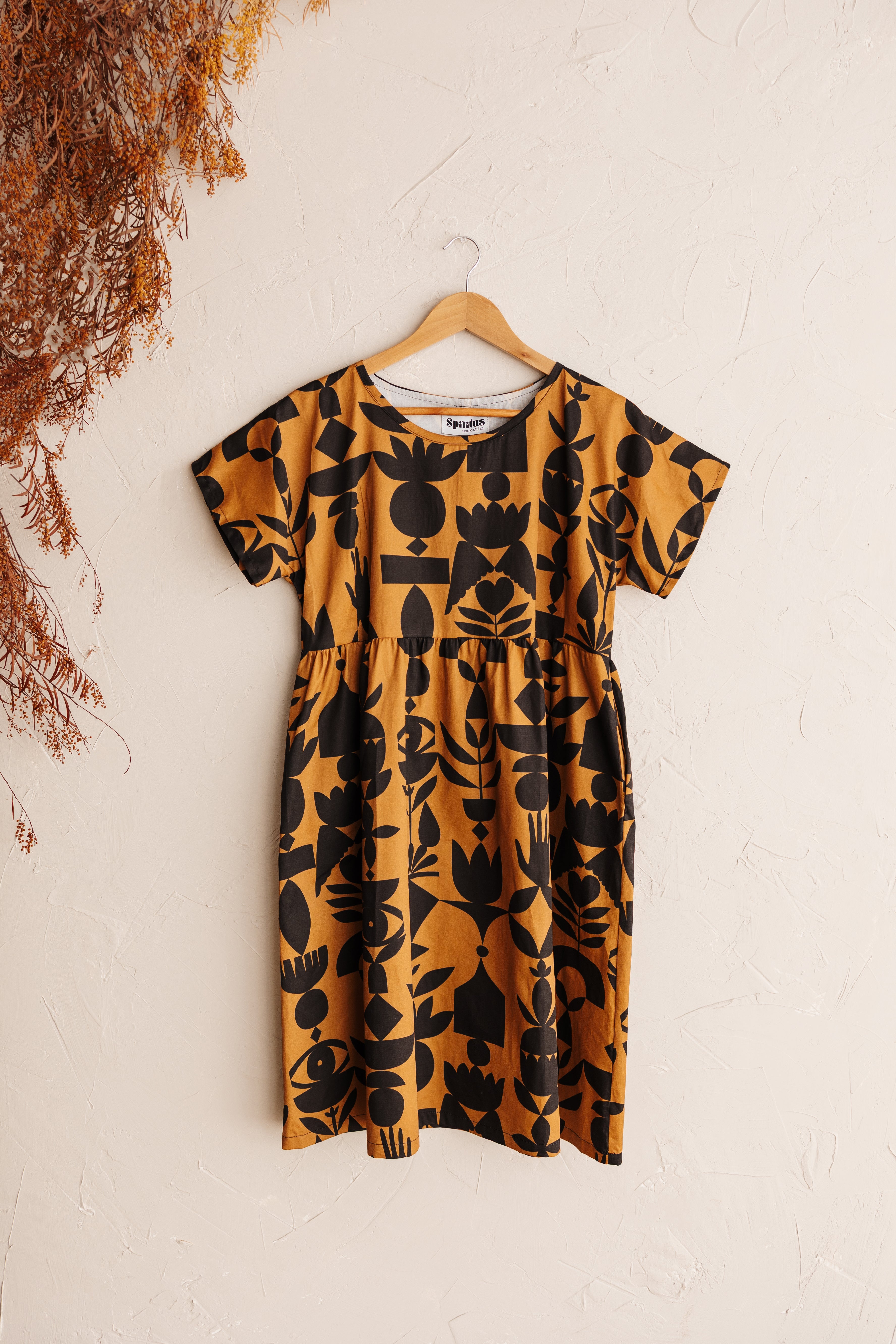 The Frida Dress in butterscotch featuring the Memento print by Cecilia Mok. Made to order in organic cotton. Handmade in the Dandenong Ranges, Australia.