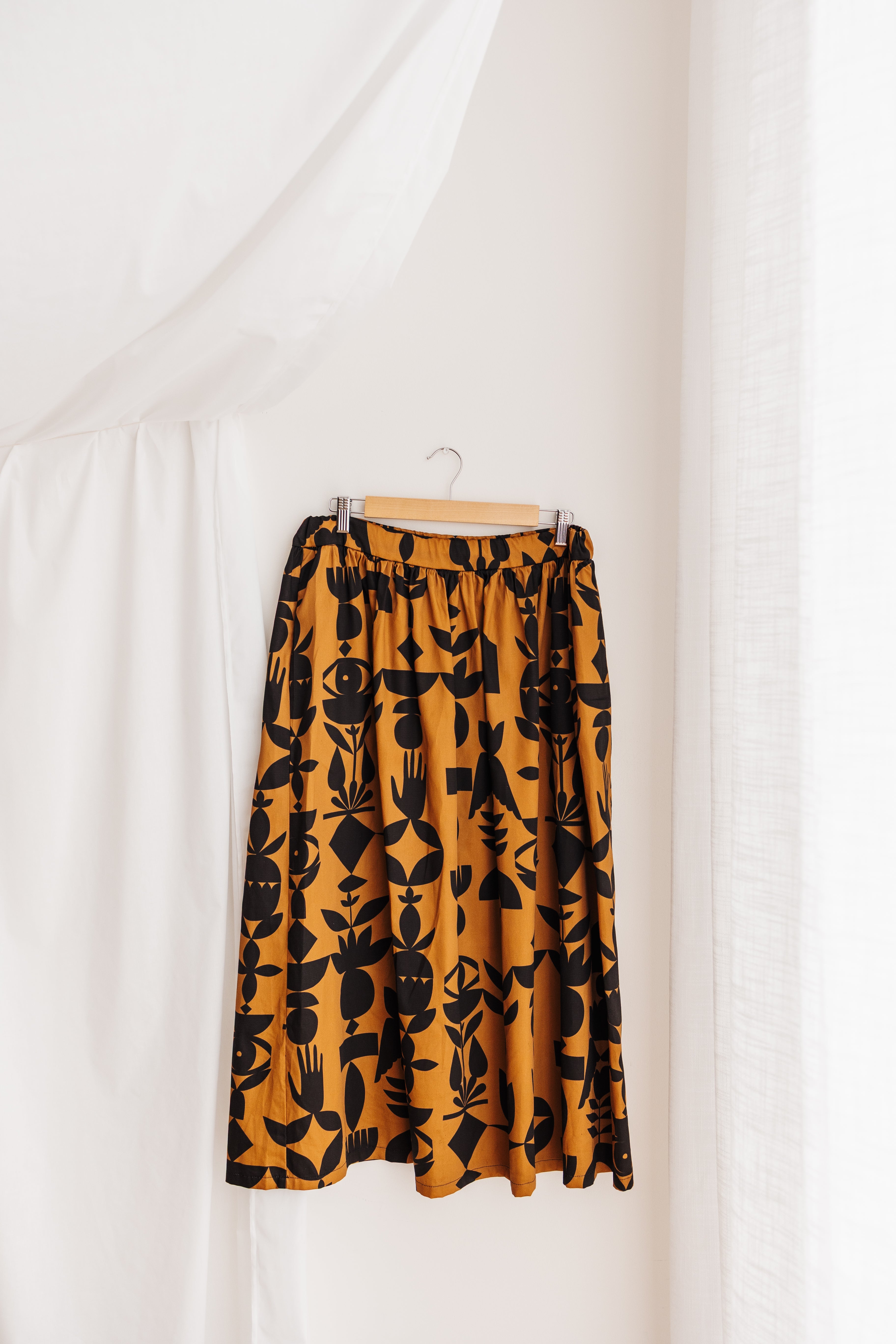 Flowing gypsy skirt in butterscotch featuring the Memento print by Cecilia Mok. Made to order in organic cotton. Handmade in the Dandenong Ranges, Australia.