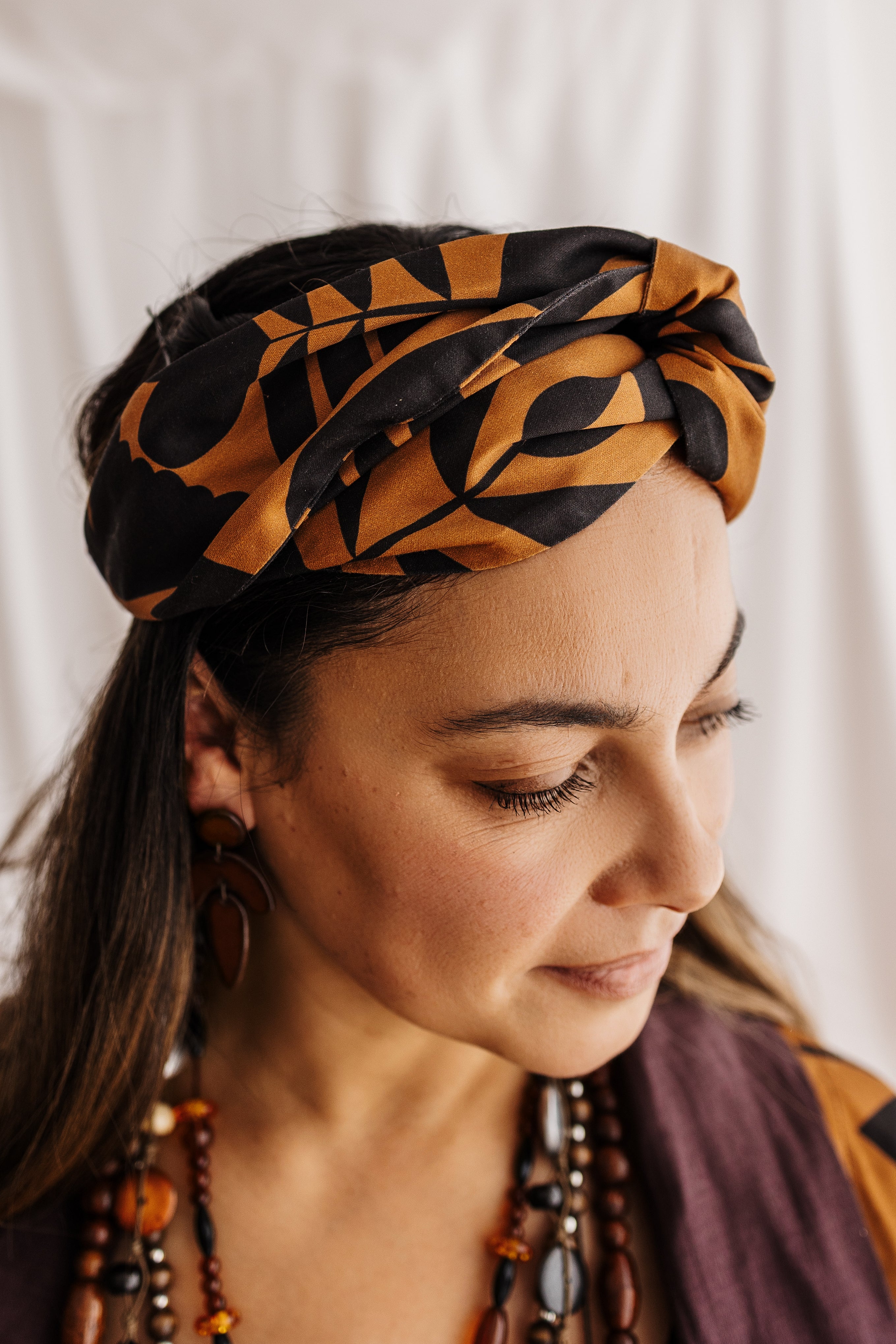 Handmade headband in butterscotch featuring the Memento print by Cecilia Mok. Made from organic cotton offcuts — zero waste Future Vintage by Spiritus Eco Clothing.