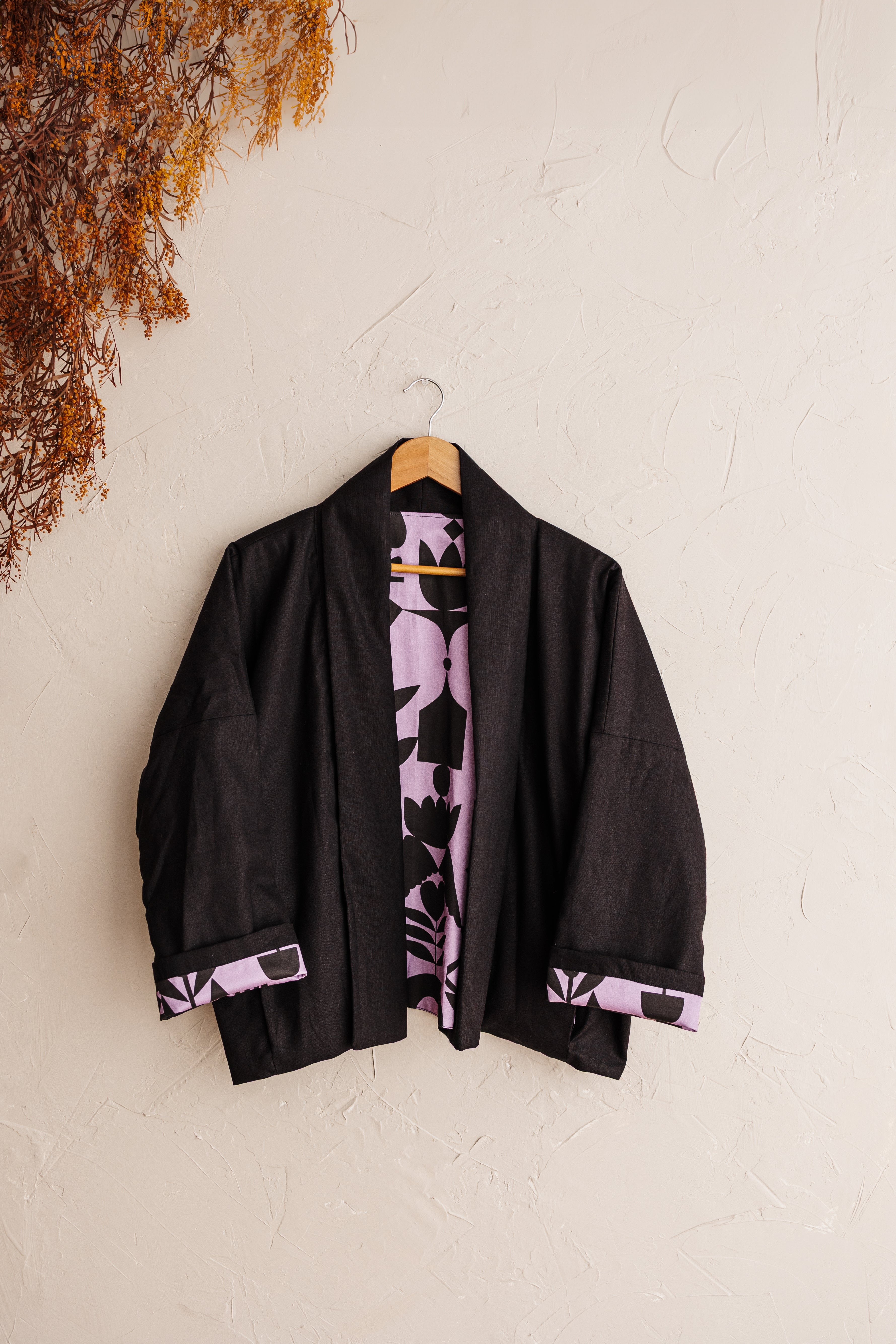 A reversible linen jacket — two looks in one. Lilac Memento print by Cecilia Mok and classic black linen. Handmade slow fashion from the Dandenong Ranges, Australia.