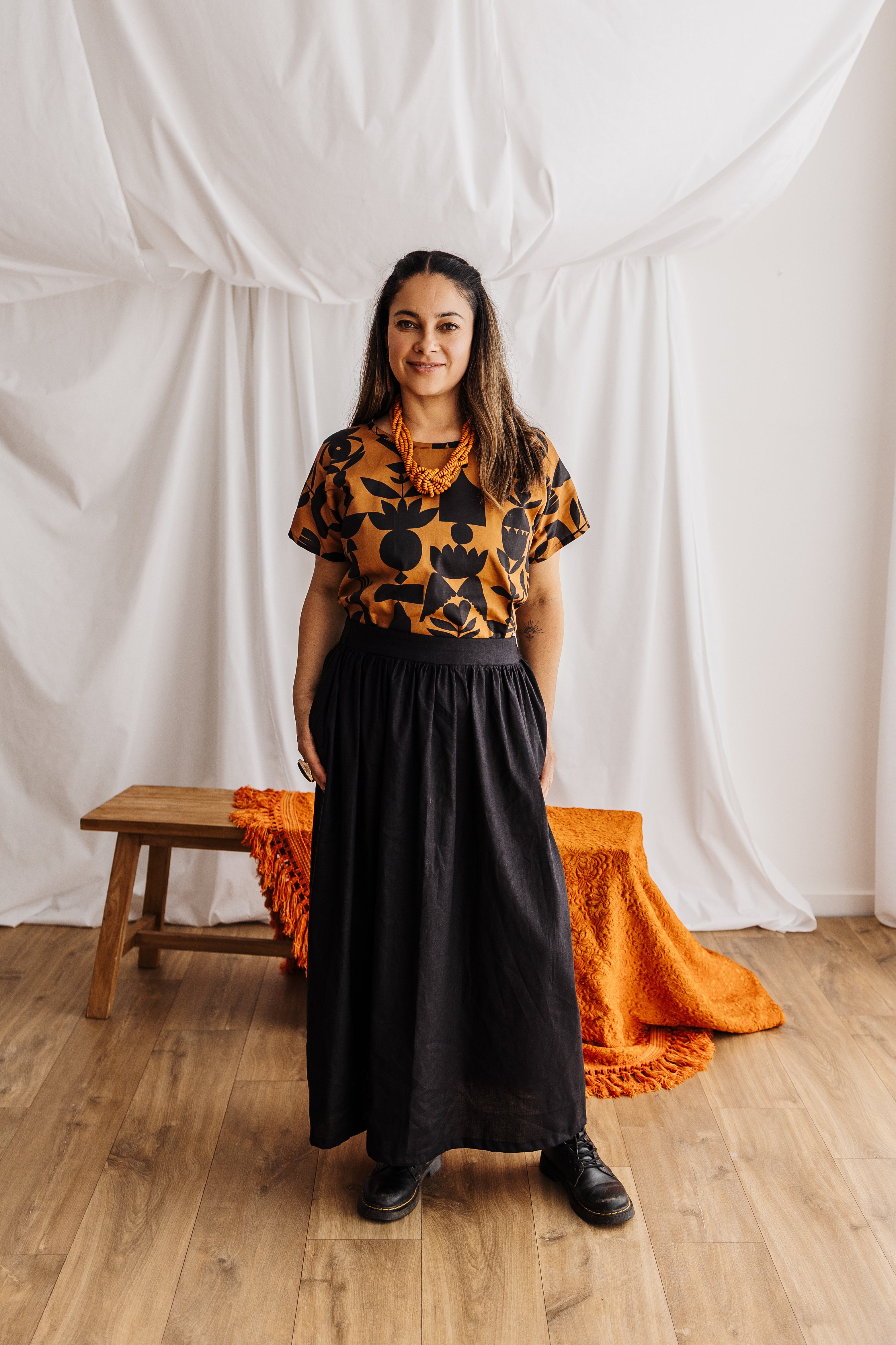 A relaxed tee in warm butterscotch featuring the Memento print by Cecilia Mok. Made to order in organic cotton. Future Vintage by Spiritus Eco Clothing.